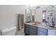 Well-lit bathroom featuring a vanity sink, mirror, and a toilet at 1331 W Baseline Rd # 360, Mesa, AZ 85202