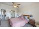Cozy bedroom featuring a ceiling fan and an ensuite bathroom entrance at 1331 W Baseline Rd # 360, Mesa, AZ 85202