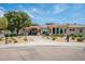 Elegant clubhouse exterior with professional landscaping, offering upscale community amenities at 1331 W Baseline Rd # 360, Mesa, AZ 85202