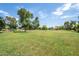 Expansive community park with mature trees, green lawns, and recreational space for residents to enjoy at 1331 W Baseline Rd # 360, Mesa, AZ 85202
