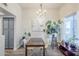 Charming dining room with view of art piece and access to kitchen area with blue cabinets at 1331 W Baseline Rd # 360, Mesa, AZ 85202