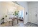 Bright dining room features modern chandelier, dining table, and easy access to front door at 1331 W Baseline Rd # 360, Mesa, AZ 85202