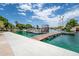 Community dock with boat slips on a sunny day, providing easy lake access for residents at 1331 W Baseline Rd # 360, Mesa, AZ 85202