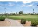 Picturesque view of the well-maintained golf course, featuring lush greens and beautiful landscaping at 1331 W Baseline Rd # 360, Mesa, AZ 85202