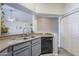 Modern kitchen featuring a stainless steel sink, dishwasher, and ample countertop space at 1331 W Baseline Rd # 360, Mesa, AZ 85202