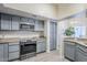 Well lit kitchen featuring stainless steel appliances, light countertops, and blue cabinets at 1331 W Baseline Rd # 360, Mesa, AZ 85202