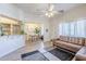 Bright and spacious living room flows into the dining area, featuring a stylish leather couch at 1331 W Baseline Rd # 360, Mesa, AZ 85202