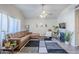 Cozy living room with a modern fireplace, a plush leather sofa, and a stylish geometric rug at 1331 W Baseline Rd # 360, Mesa, AZ 85202