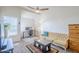 Inviting living room featuring natural light, a ceiling fan, and dedicated desk space at 1331 W Baseline Rd # 360, Mesa, AZ 85202