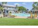 Inviting community pool area with comfortable lounge chairs and lush green surroundings at 1331 W Baseline Rd # 360, Mesa, AZ 85202