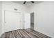 Neutral bedroom featuring wood-look floors and ample closet space at 1351 N Pleasant Dr # 2011, Chandler, AZ 85225