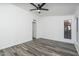 Bedroom with wood-look floors, ceiling fan, a window and white walls at 1351 N Pleasant Dr # 2011, Chandler, AZ 85225