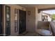 Charming unit entrance with secure door and cozy outdoor seating area at 1351 N Pleasant Dr # 2011, Chandler, AZ 85225