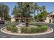 Picturesque community fountain surrounded by lush landscaping and mature trees at 1351 N Pleasant Dr # 2011, Chandler, AZ 85225