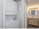 Convenient laundry area featuring a stacked washer and dryer unit at 1351 N Pleasant Dr # 2011, Chandler, AZ 85225