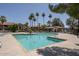 Large, beautiful community pool surrounded by lush greenery and palm trees at 1351 N Pleasant Dr # 2011, Chandler, AZ 85225