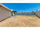Large backyard featuring an outdoor recreation court, offering space for activities and entertainment at 13805 N 31St Ave, Phoenix, AZ 85053