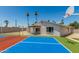 A spacious backyard featuring a colorful sport court, perfect for recreation and outdoor enjoyment at 13805 N 31St Ave, Phoenix, AZ 85053