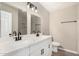 Bathroom with double sink, modern fixtures, and tiled shower at 13805 N 31St Ave, Phoenix, AZ 85053