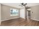 Bedroom with wood-look flooring, ceiling fan, a closet, and a window view of the sports court at 13805 N 31St Ave, Phoenix, AZ 85053