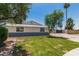 Lovely home with a green lawn, mature trees, offering an inviting and serene residential setting at 13805 N 31St Ave, Phoenix, AZ 85053