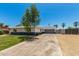 Inviting single-Gathering home featuring a long driveway and a well-maintained lawn, exuding suburban comfort at 13805 N 31St Ave, Phoenix, AZ 85053