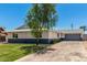 Charming home with a well-kept lawn and lengthy driveway, offering ample parking and curb appeal at 13805 N 31St Ave, Phoenix, AZ 85053