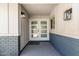 Welcoming front entrance with double doors and stylish exterior lighting, creating a warm first impression at 13805 N 31St Ave, Phoenix, AZ 85053