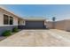 Spacious two-car garage with a concrete driveway and neatly trimmed landscaping, offering functionality at 13805 N 31St Ave, Phoenix, AZ 85053