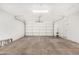 A bright, spacious two car garage with white walls and door at 13805 N 31St Ave, Phoenix, AZ 85053