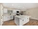 Updated kitchen featuring stainless appliances, marble backsplash, quartz countertops, and a large island at 13805 N 31St Ave, Phoenix, AZ 85053