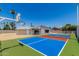 The backyard features a vibrant sport court with basketball hoops, perfect for outdoor activities and recreation at 13805 N 31St Ave, Phoenix, AZ 85053