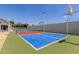 Bright sport court features colorful surfaces, basketball hoops, and is great for exercise and fun at 13805 N 31St Ave, Phoenix, AZ 85053