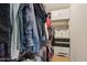 Walk-in closet featuring ample hanging space, built-in shelving, and efficient storage solutions for organization at 14822 N Tonya Cir, El Mirage, AZ 85335