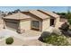 Well-maintained single-story home with desert landscaping and a two-car garage at 14822 N Tonya Cir, El Mirage, AZ 85335