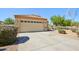 Inviting single-story home with a spacious driveway and desert-friendly landscaping at 14822 N Tonya Cir, El Mirage, AZ 85335