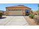 Charming single-level home featuring a two-car garage and low-maintenance landscaping at 14822 N Tonya Cir, El Mirage, AZ 85335