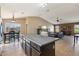 Open kitchen featuring granite countertops, a large island, and seamless flow into living and dining areas at 14822 N Tonya Cir, El Mirage, AZ 85335