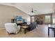 Spacious living area featuring neutral paint, tile floors, and large windows at 14822 N Tonya Cir, El Mirage, AZ 85335