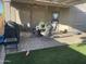 Outdoor patio offers a beautiful place to entertain with dining set and grill in a relaxing backyard at 178 W Pacific Dr, Casa Grande, AZ 85122