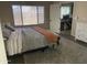 Relaxing bedroom with natural light and view to a dedicated office space at 178 W Pacific Dr, Casa Grande, AZ 85122