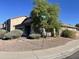 Corner lot home with manicured landscaping and mature shade tree at 178 W Pacific Dr, Casa Grande, AZ 85122