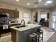 Open concept kitchen with a large island, granite countertops, and views into a connecting room at 178 W Pacific Dr, Casa Grande, AZ 85122