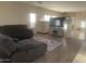 Comfortable living room with cozy sectional sofa and view of backyard at 178 W Pacific Dr, Casa Grande, AZ 85122