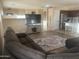 Open living space showcasing the living room connected to the kitchen area at 178 W Pacific Dr, Casa Grande, AZ 85122