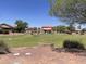 A neighborhood park offers green space and a shaded playground for children at 178 W Pacific Dr, Casa Grande, AZ 85122
