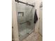 Sleek glass-enclosed shower with built-in niche and modern hardware at 178 W Pacific Dr, Casa Grande, AZ 85122