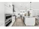 A modern kitchen featuring a spacious island and stainless steel appliances at 1785 W Brooke Ln, Queen Creek, AZ 85144