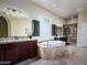Bright bathroom featuring a large soaking tub, double vanities, and a walk-in shower at 1809 E Gwen St, Phoenix, AZ 85042