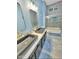 Modern bathroom with double sinks, decorative mirrors, and a tiled shower at 1809 E Gwen St, Phoenix, AZ 85042